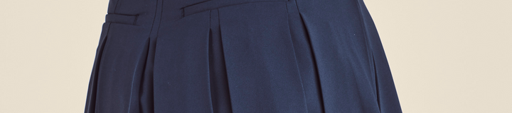 STUDIO SEOUL LOGO BANDING PLEATED SKIRT