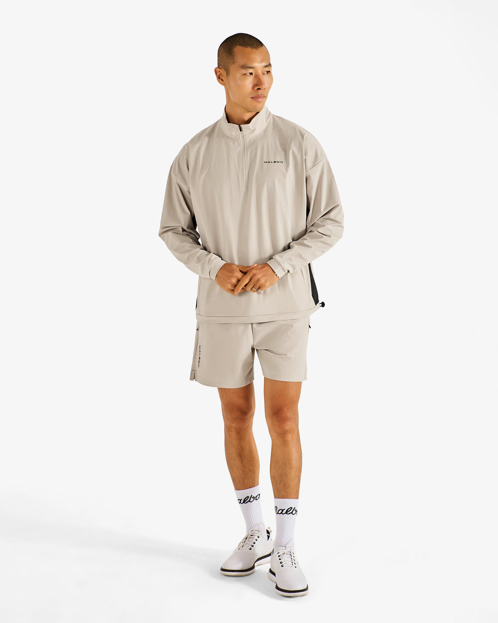 PERFORMANCE QUARTER ZIP SHELL PULLOVER