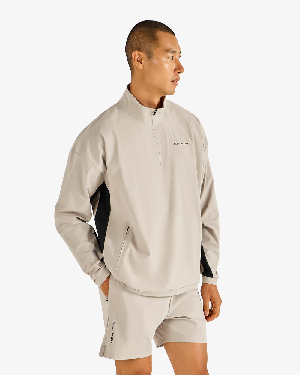 PERFORMANCE QUARTER ZIP SHELL PULLOVER
